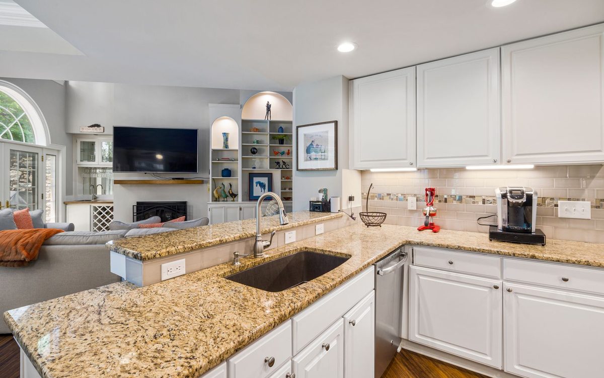 Bright kitchen with white cabinets and almost-bare counters